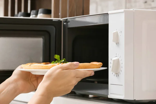 Woman Taking Plate Pizza Microwave Oven Kitchen Closeup — Stock Photo, Image