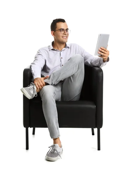 Young Man Using Tablet Computer Black Armchair White Background — Stock Photo, Image