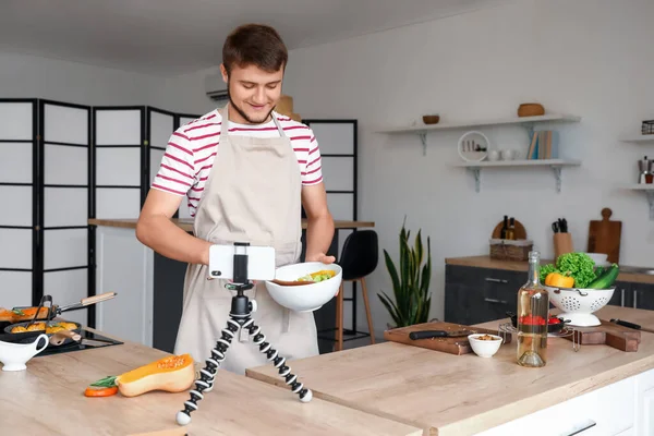 Young Man Making Salad While Recording Cooking Video Tutorial Kitchen — Stock Photo, Image