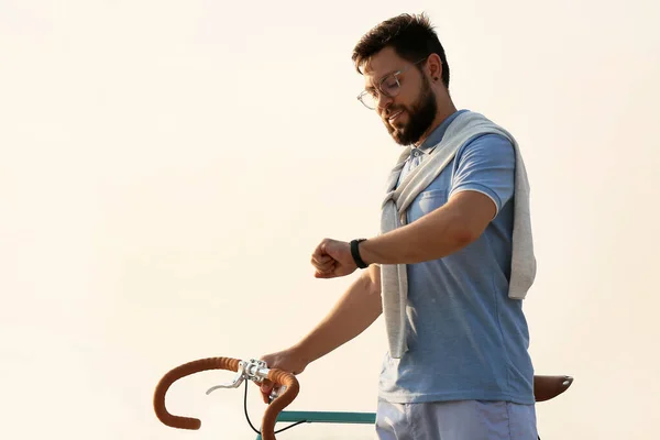 Young Bearded Man Bicycle Looking Wristwatch Outdoors — Stock Photo, Image