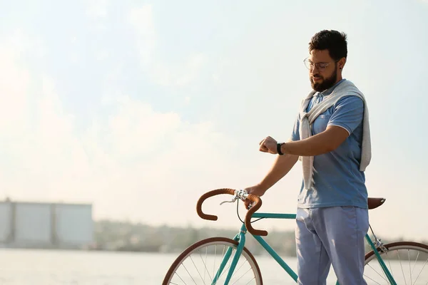 Young Bearded Man Bicycle Looking Wristwatch Embankment — Stock Photo, Image