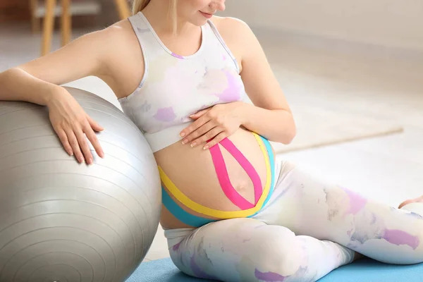 Sporty Pregnant Woman Applied Kinesio Tape Home — Stock Photo, Image