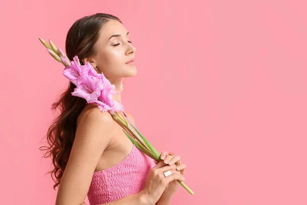Young Woman Closed Eyes Holding Beautiful Gladiolus Flowers Color Background — Stock Photo, Image