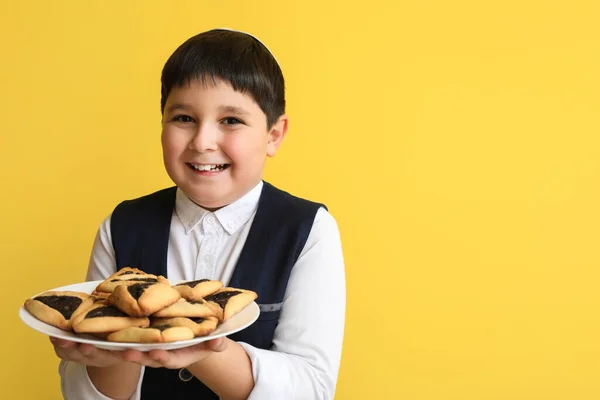 Little Jewish Boy Tasty Hamantaschen Purim Holiday Color Background — Stock Photo, Image