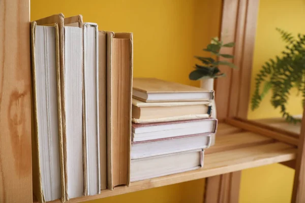 Wooden Shelf Books Yellow Wall Closeup — Stock Photo, Image