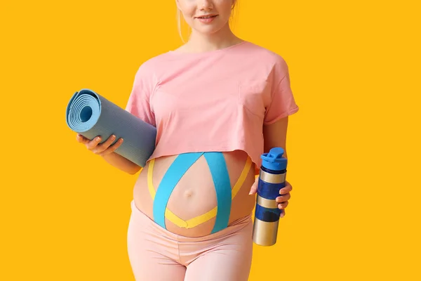 Sporty Pregnant Woman Applied Kinesio Tape Color Background — Stock Photo, Image