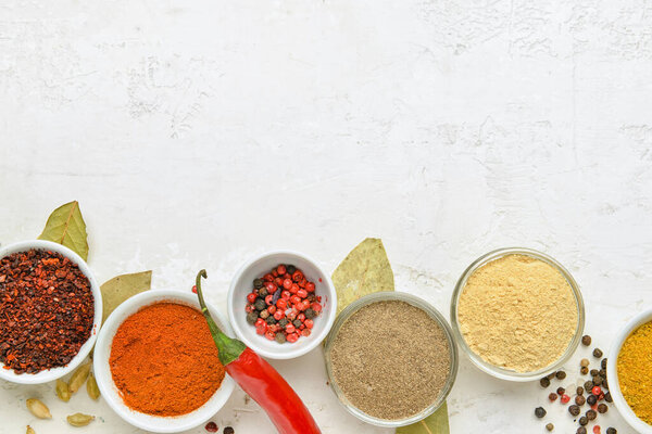Set of different aromatic spices on light background