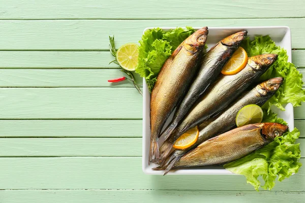 Plate Smoked Herring Fishes Green Wooden Background — Stock Photo, Image