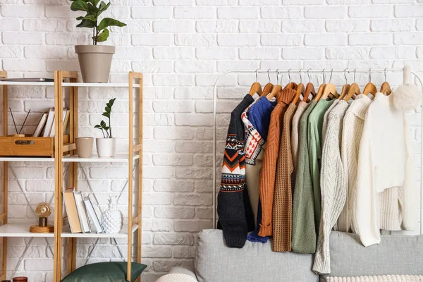 Shelf Unit Sofa Rack Sweaters White Brick Wall — Stock Photo, Image
