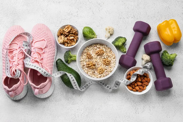 Bowls Healthy Food Sneakers Dumbbells Measuring Tape Light Background Diet — Stock Photo, Image