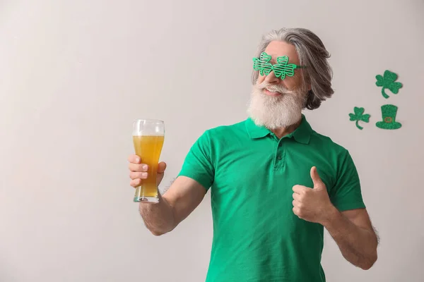 Senior Man Eyeglasses Glass Beer Showing Thumb Light Background Patrick — Stock Photo, Image