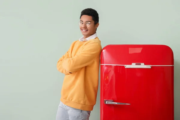 Young African American Man Stylish Red Fridge Color Background — Stock Photo, Image