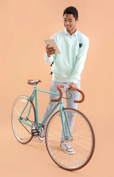 Male African American Student Bicycle Tablet Computer Color Background — Stock Photo, Image