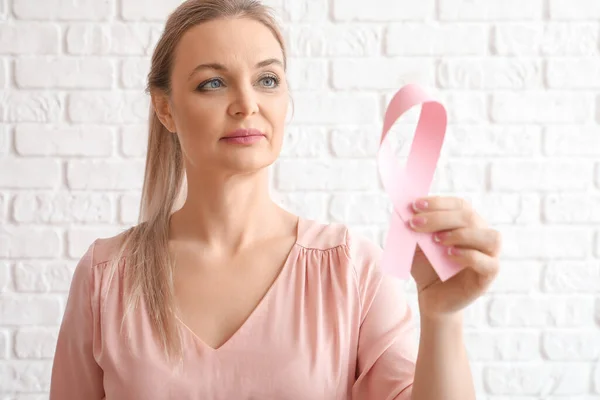 Woman Holding Pink Awareness Ribbon White Brick Wall Background Breast — Stock Photo, Image