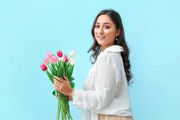Elegant Woman Creative Makeup Holding Bouquet Tulips Blue Background International — Stock Photo, Image