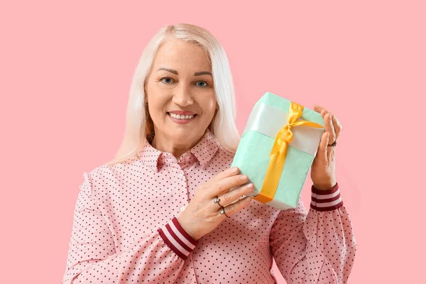 Beautiful Mature Woman Holding Gift Box Pink Background International Women — Stock Photo, Image