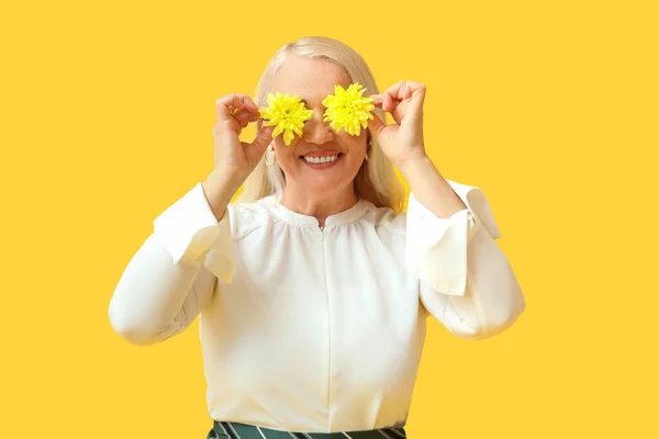 Happy Mature Woman Closing Face Flowers Yellow Background International Women — Stock Photo, Image