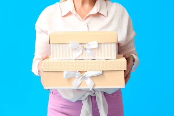 Mature Woman Holding Stack Gift Boxes Blue Background Closeup International — Stock Photo, Image