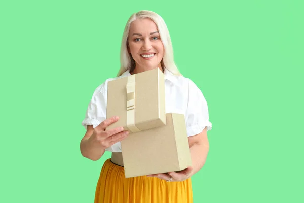 Smiling Mature Woman Opening Gift Box Green Background International Women — Stock Photo, Image