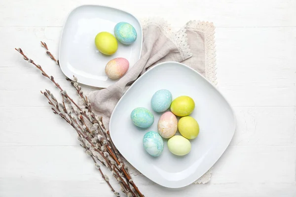 Plates Painted Easter Eggs Willow Branches Napkin White Wooden Background — Stock Photo, Image