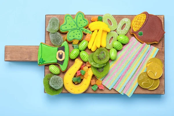 Wooden Board Different Sweets Patrick Day Celebration Blue Background — Stock Photo, Image