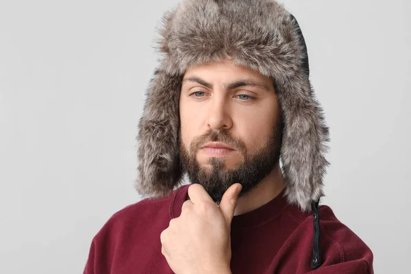 Stylish Bearded Man Sweater Ear Flapped Hat Light Background — Stock Photo, Image