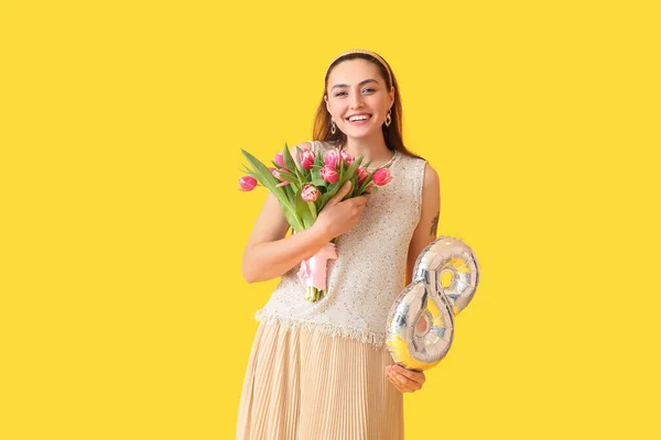 Happy Young Woman Bouquet Balloon Shape Figure Yellow Background International — Stock Photo, Image