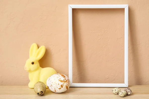 Composition Photo Frame Easter Eggs Bunny Table Beige Wall — Stock Photo, Image