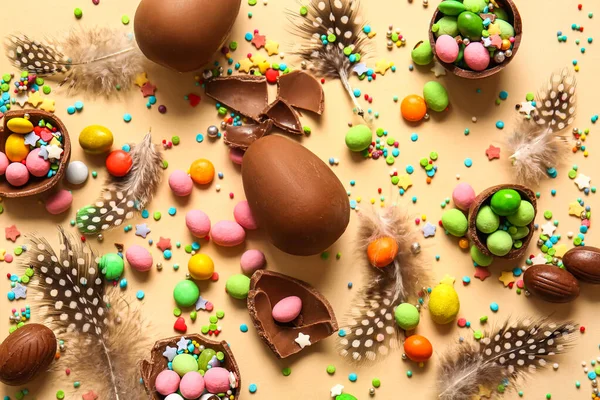 Composition Chocolate Easter Eggs Different Candies Feathers Beige Background — Stock Photo, Image