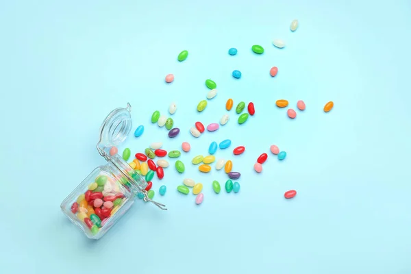 Glass Jar Different Jelly Beans Blue Background — Stock Photo, Image