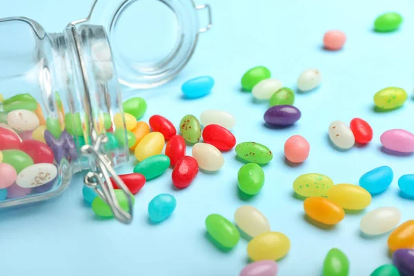 Glass Jar Different Jelly Beans Blue Background Closeup — Stock Photo, Image