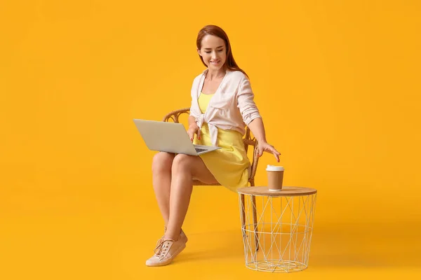 Young Redhead Woman Laptop Taking Cup Coffee Yellow Background — Stock Photo, Image