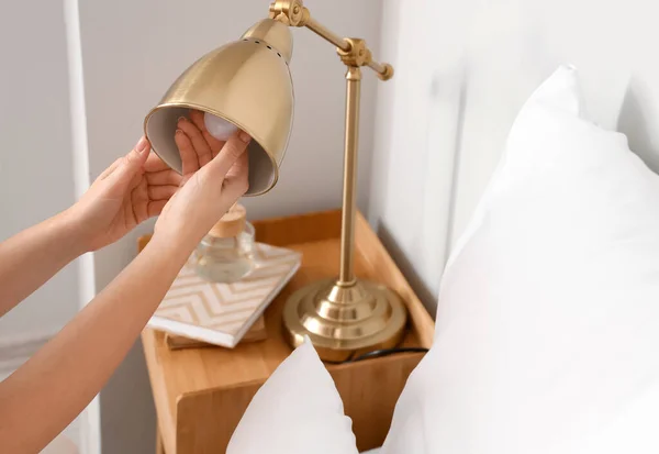 Woman Changing Light Bulb Golden Lamp Home Closeup — Stock Photo, Image