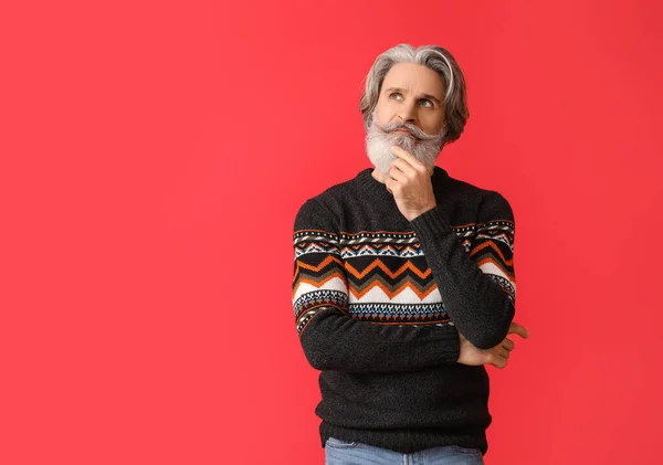 Thoughtful Senior Man Knitted Sweater Red Background — Stock Photo, Image