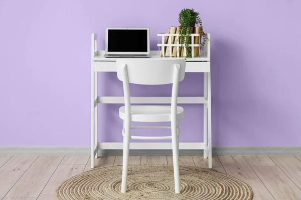 Modern Workplace Laptop Books Houseplant Violet Wall Room Interior — Stock Photo, Image