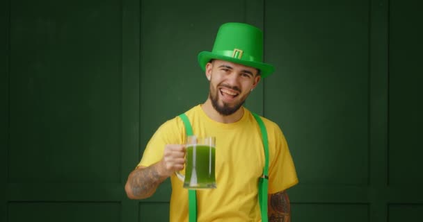 Handsome Tattooed Man Drinking Green Beer Color Background Patrick Day — Stock Video