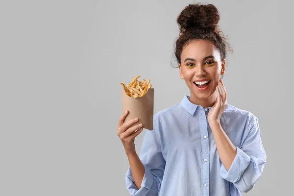 Young African American Woman French Fries Light Background — Stock Photo, Image