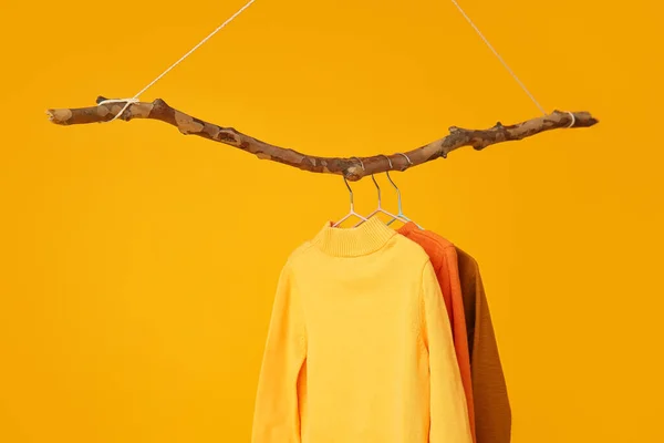 Different Knitted Sweaters Orange Background — Stock Photo, Image
