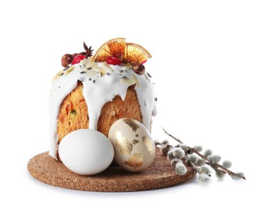 Board with delicious Easter cake, pussy willow branches and eggs isolated on white background