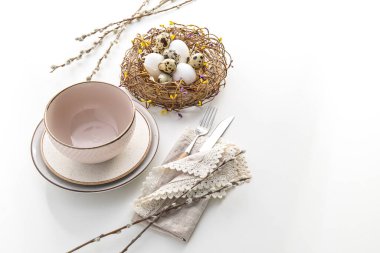 Beautiful Easter table setting with pussy willow branches on white background