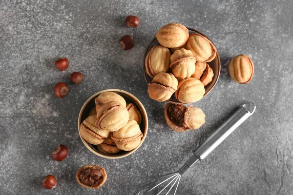 Bowls Tasty Walnut Shaped Cookies Boiled Condensed Milk Grey Background — Stock Photo, Image