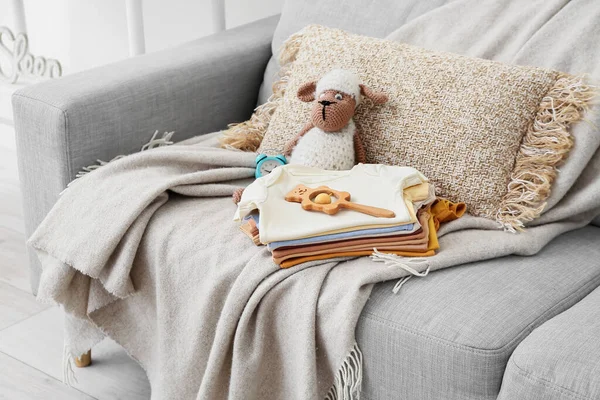 Stack Baby Clothes Toys Comfortable Sofa — Stock Photo, Image