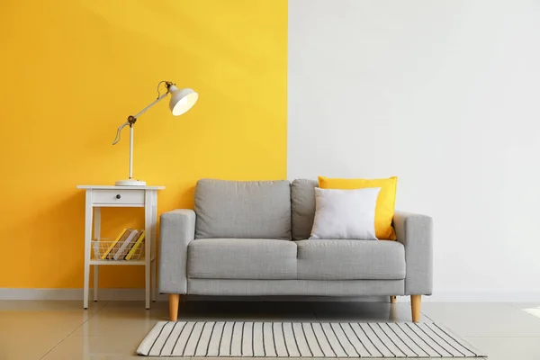 Table Glowing Lamp Grey Sofa Color Wall — Stock Fotó