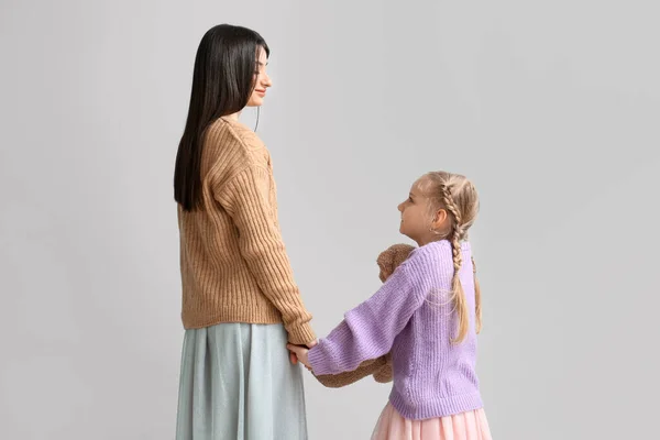 Little Girl Her Mother Warm Sweaters Holding Hands Light Background — Stock Photo, Image