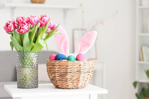 Basket Easter Eggs Bunny Ears Vase Tulips Table Light Room — Stock Photo, Image