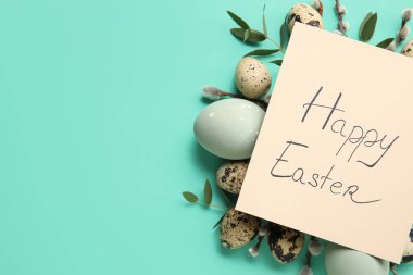 Greeting card with text HAPPY EASTER, eggs and pussy willow branches on color background