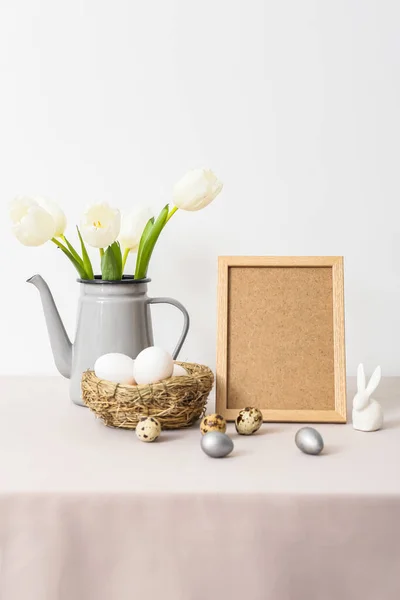 Blank Photo Frame Nest Easter Eggs Rabbit Tulips Table Light — Stock Photo, Image