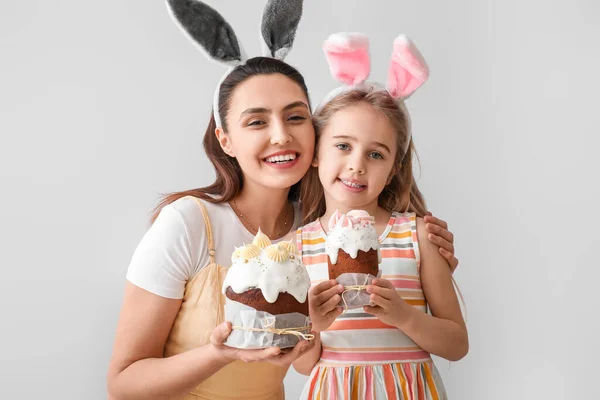 Little Girl Her Mother Bunny Ears Easter Cakes Light Background — Stock Photo, Image