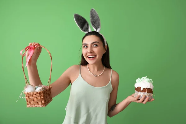 Young Woman Tasty Easter Cake Eggs Basket Green Background — Stock Photo, Image