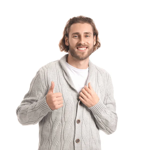 ハンサムな若いです男でニットセーターショー親指アップ上の白い背景 — ストック写真